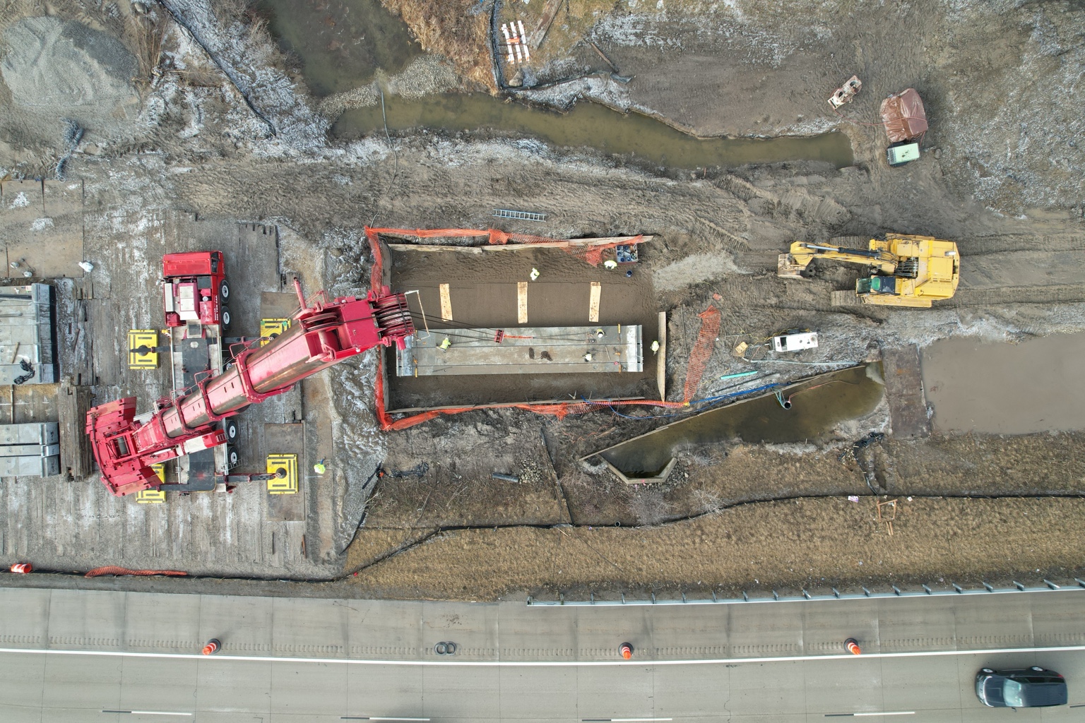 Overhead photograph of a crane and rectangular excavation