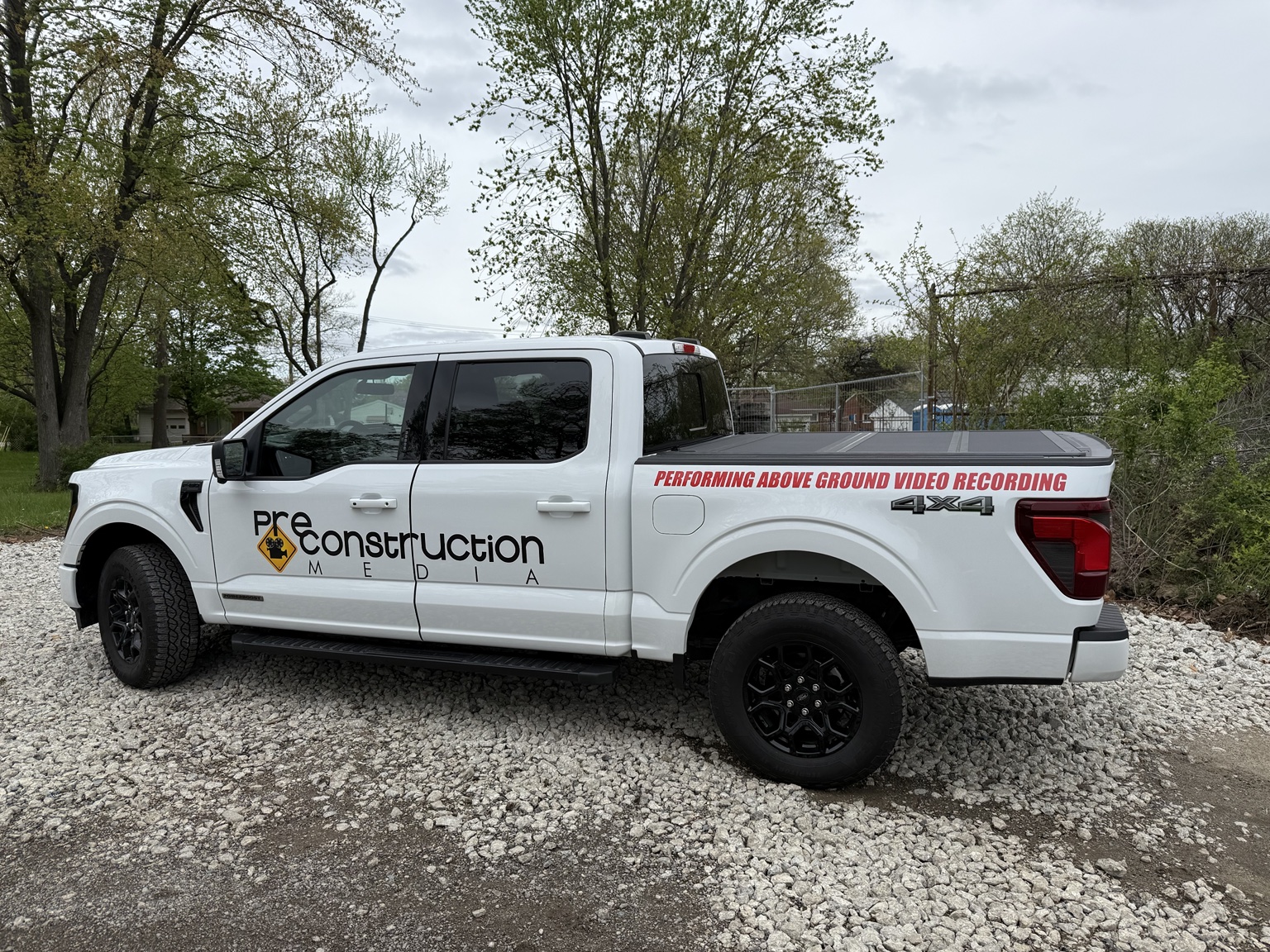 Pre-Construction Media branded pickup truck for field video documentation