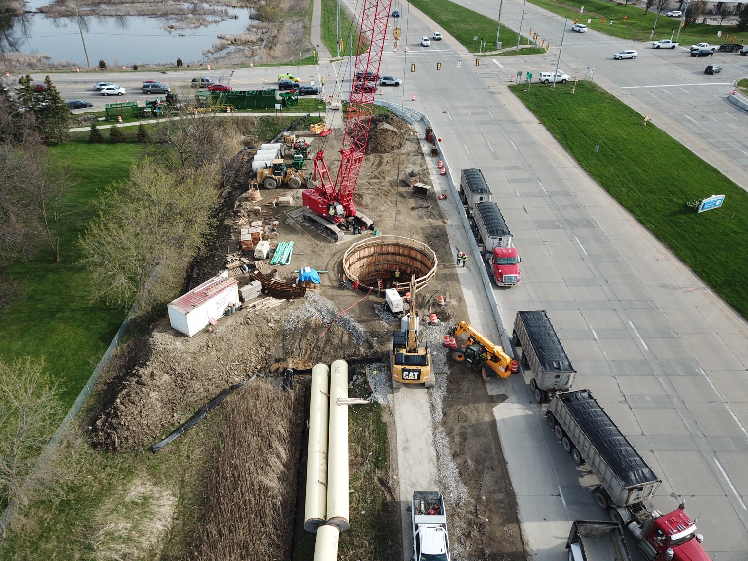 Aerial overview of roadside shaft construction and equipment